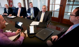 Smart Choice sales executives (opposite side of table from right to left) Paul Taylor, Executive Vice President; Oliver Travieso, Vice President, Sales & Distribution; Ashley Wingate, Vice President Sales, East Coast; and Steve Ford, Vice President, Commercial Lines meet with Andrew Caldwell, President (right) and carrier partner representatives.