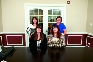 The Personal Lines Team. Sitting from left: Rochelle Krouse, Personal Lines Specialist, and Charity Weber, Personal Lines Specialist. Standing from left: Jeanne Dominy, Personal Lines Specialist, and Christine J. Broholm, Personal Lines Manager. 