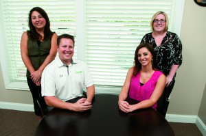 The Commercial Lines Team. Sitting from left: Scott M. Elmlund, and Nicole Clemans, Insurance Consultant. Standing from left: Niki Block, Account Manager, and Jeannine Blase, Account Manager. 