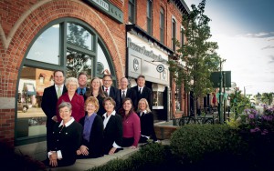 The Whims Insurance Agency, Inc. commercial lines team includes: (seated left to right) Gladys B. Lazzara; Susan Bakke; Connie Klix Mercer; Tricia Judge Fricke; Heidi Schluessler; (standing left to right) Eric Putman; Elizabeth Hurst; Andrew Muma; Amanda Galat; Tom Klix; John Tocco; and Lars Nordberg.